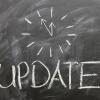 Chalkboard with the word "Update" and a drawing of a clock